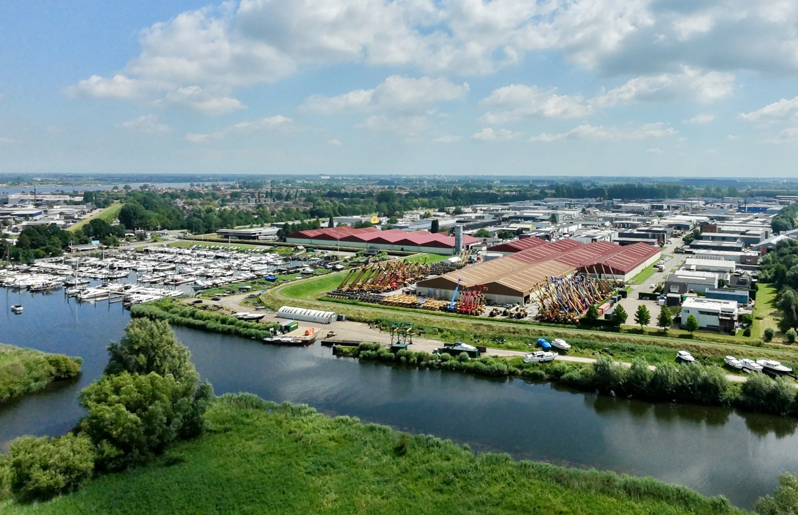 Aerial drone view of Magterra's waterfront logistics site with harbour and warehousing